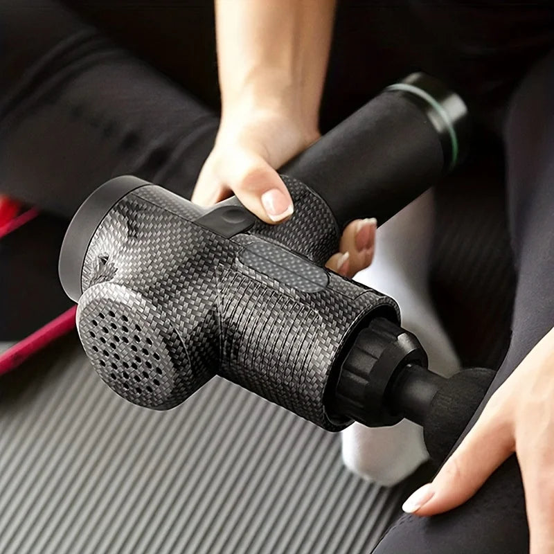 Massage Gun Soothe PRO grey carbon fibre person using muscle leg